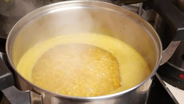  slow motion of cooking dhal in hot water 