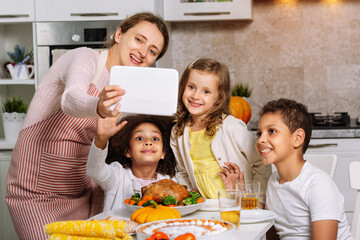 Wish you a happy Thanksgiving. The family sits at the table and celebrates the holiday.
