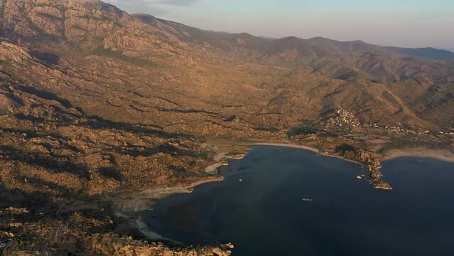 Aerial footage of a lake and islands, top view of bafa lake with sunset light and day time light