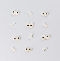 Sugar eyes and bones. On a white background, Halloween-themed sugar decor.