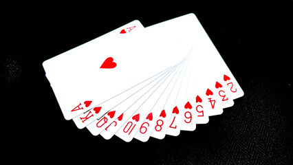 Casino playing card over black background isolation.