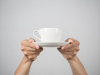 Hands giving white coffee cup isolated