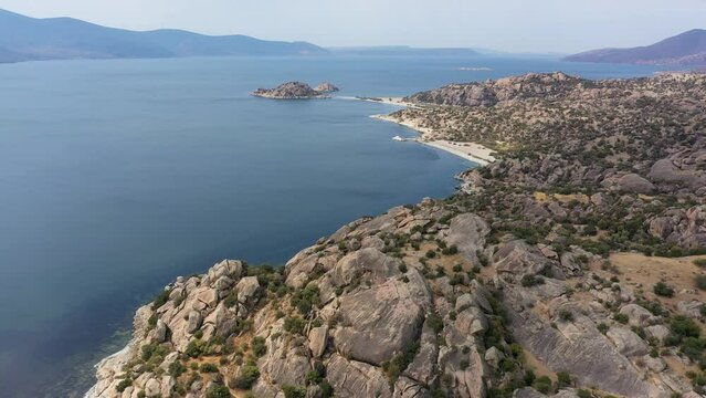 Aerial footage of a lake and islands, top view of bafa lake with sunset light and day time light