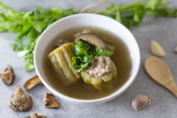 Stuffed bitter gourd with seasoned minced pork soup Thai foods on white background