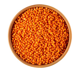 Red lentils uncooked pile in clay pot, top view