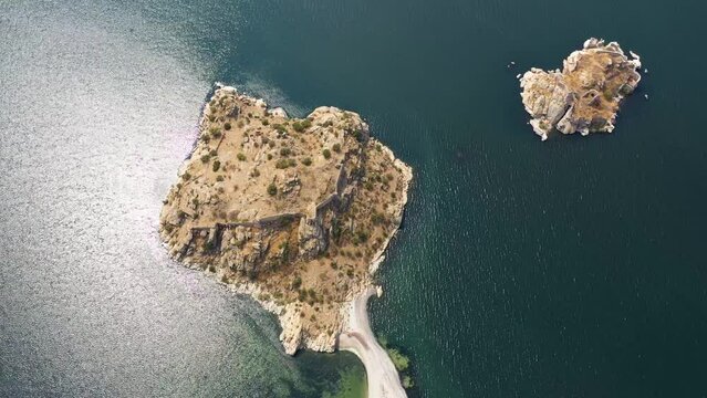 Aerial footage of a lake and islands, top view of bafa lake with sunset light and day time light