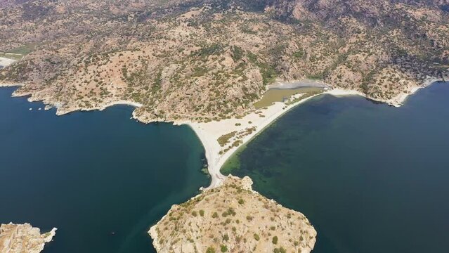 Aerial footage of a lake and islands, top view of bafa lake with sunset light and day time light
