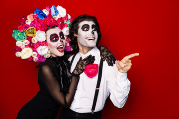 Photo of two people zombie scary man lady cuddle direct finger look empty space excited neighbors...