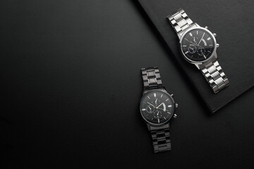Luxury white and black chrome watches on black background - Powered by Adobe