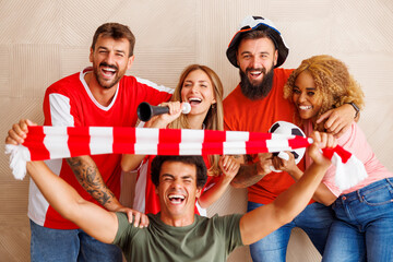 Portrait of cheerful football fans