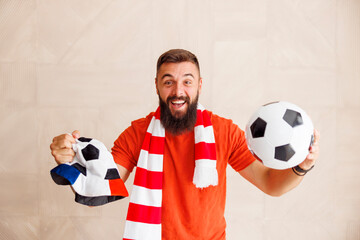 Male football fan cheering for his team
