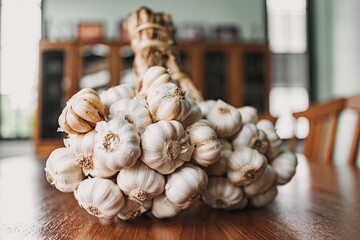 Bunch of garlic on the kitchen table. Concept of prepare cooking.