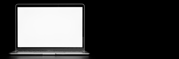 modern laptop computer on the table on the black background