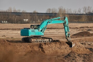 Fototapeta na wymiar Construction site excavator and truck