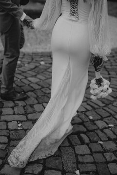 bride and groom walking on the street
