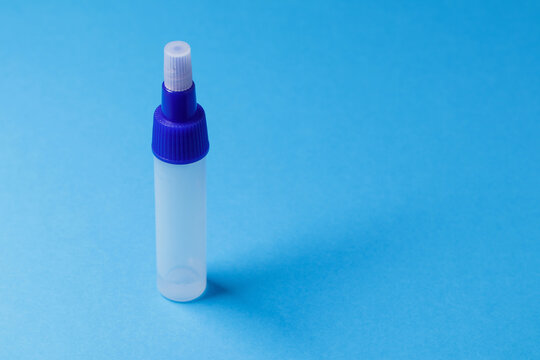 Test tube, container on blue background with free space for text, copy space. Virus detection, transfer analysis, drug testing, concept of health examinations