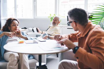 Diverse colleagues resting in lounge room