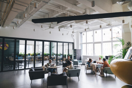 Group of colleagues working in spacious office