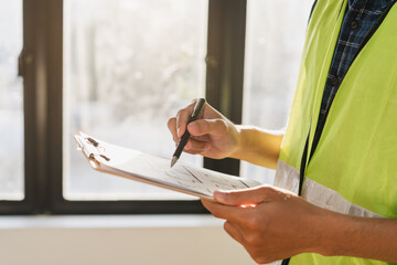 Building inspection, asian contractor young man, male inspecting home, reconstructed construction,...
