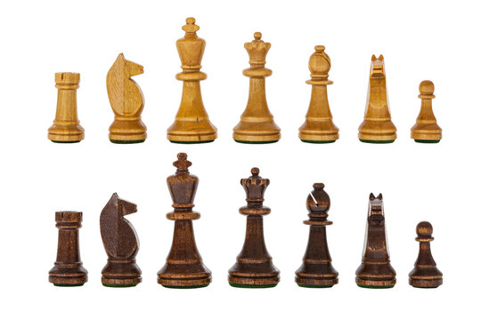 Vintage wooden chess set pieces isolated.