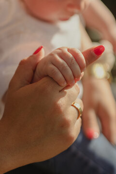child holding mum's hand