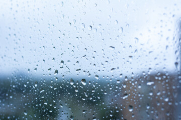 Water drops on window glass close up, selective focus