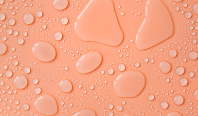 Drops of liquid, moisturizing cosmetic product. Hyaluronic acid. Selective focus.