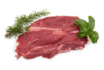 Raw beef steak with rosemary and basil leaves isolated on white