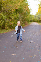 Fototapeta premium little boy running in the park