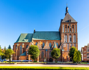 XIV century gothic Holy Mary Immaculate Conception Cathedral at Zwyciestwa street in historic old town quarter of Koszalin in Poland