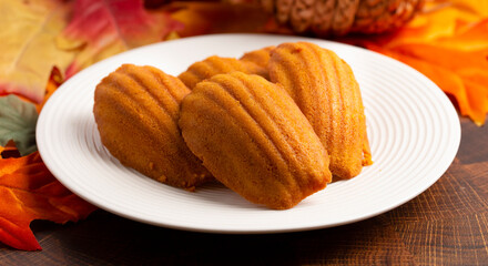 Pumpkin Madeleine Cookies on a Wooden Table