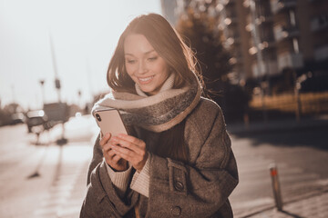 Photo of adorable cute lady dressed warm coat scarf typing instagram twitter facebook telegram...