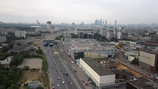 Establishing shot on the expressway third ring in Moscow. Aerial view of the highway in a large metropolis in summer