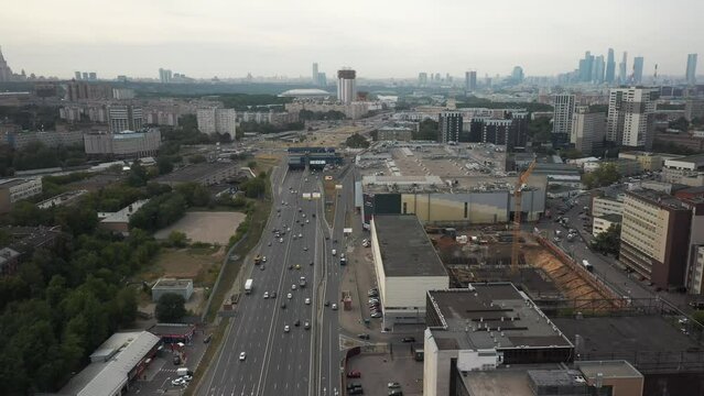 Establishing shot on the expressway third ring in Moscow. Aerial view of the highway in a large metropolis in summer