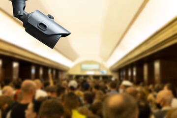 Obraz premium CCTV, security camera system operating with people waiting subway at train station, surveillance security and safety technology concept.