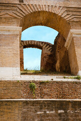 Arched ruins near Roman Colosseum in Italy