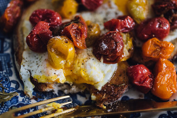 roasted cherry, grape tomatoes with fried egg on toast