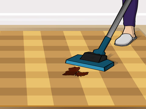 Cleaning carpet with a vacuum cleaner.