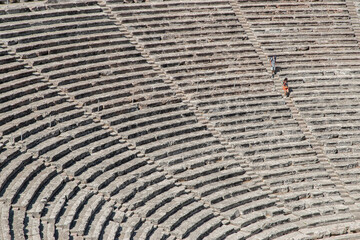 Stone seats of an ancient Greek theater in sunny day