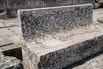 Stone seats of an ancient Greek theater in sunny day
