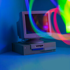 Long exposure. Vintage PC in a blue room with bold graduated colors. Red, blue, green, yellow...