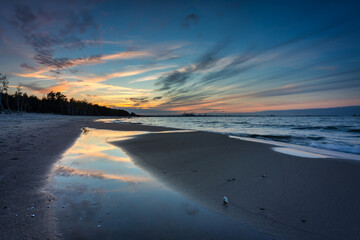 Sunset on the beach of the Baltic Sea in Gdansk, Poland