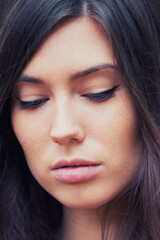 Fototapeta premium Portrait of beautiful young woman with long brown hair