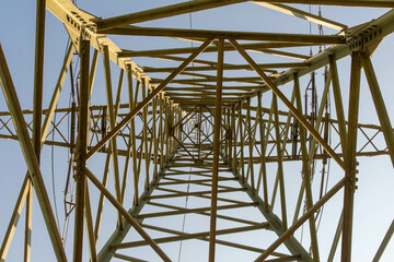 Electricity pylon looked up at the sky from below
