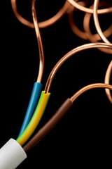 Copper electrical cable wire on black background