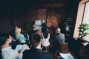 Photo of serious busy recruiter showing company pluses new employees indoors boardroom workplace...