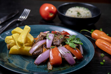 Typical peruvian food, lomo saltado (tenderloin steak)