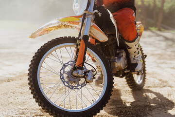 Close up motorbike. Extreme and Adrenaline. Motocross rider in action. Active lifestyle.