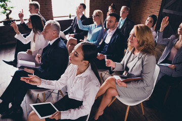 Photo of crowd business people sitting chair conference room raise arm ask question building indoors