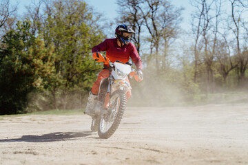 Extreme and Adrenaline. Motocross rider in action. Motocross sport. Active lifestyle. Flying dust.